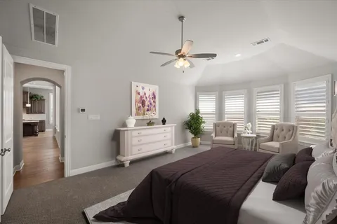 a bed room with a bed and a chandelier