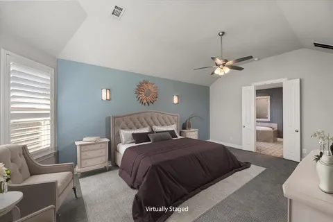 a bedroom with a bed and window