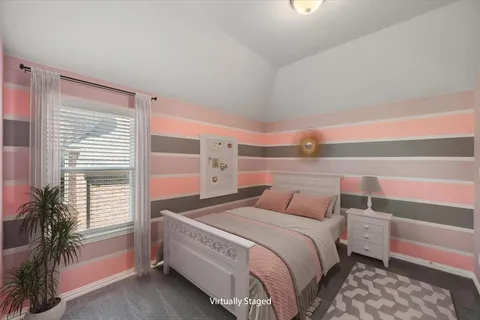 a bedroom with a bed and a potted plant