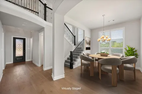 a view of a livingroom with furniture window and wooden floor