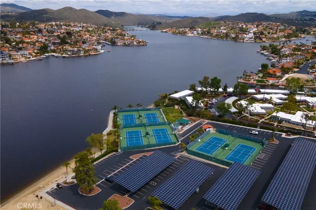 an aerial view of a house with a lake view