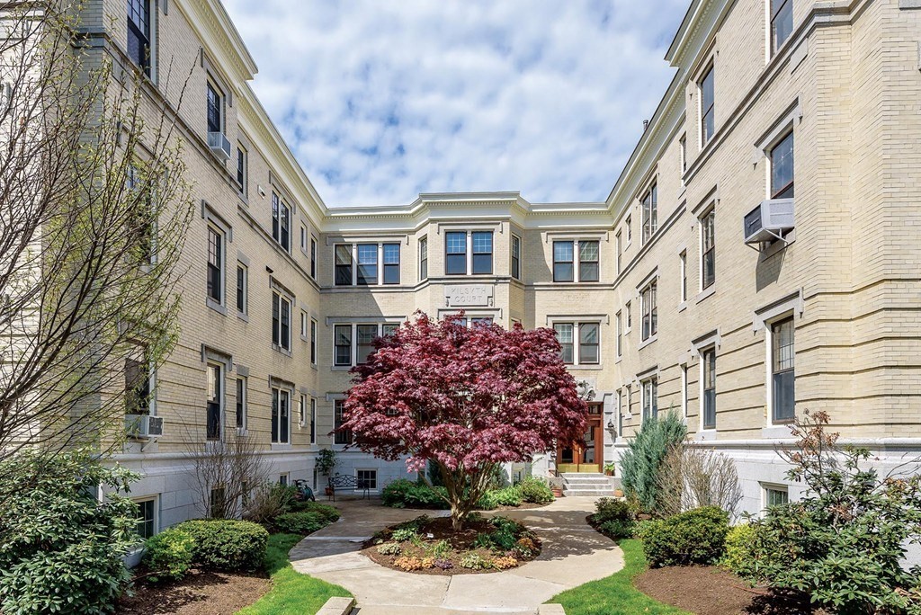 38 Kilsyth Road, Unit 33 Brookline, MA 02445 - Photo 1 of 23 a front view of a multi story residential apartment building with yard and parking