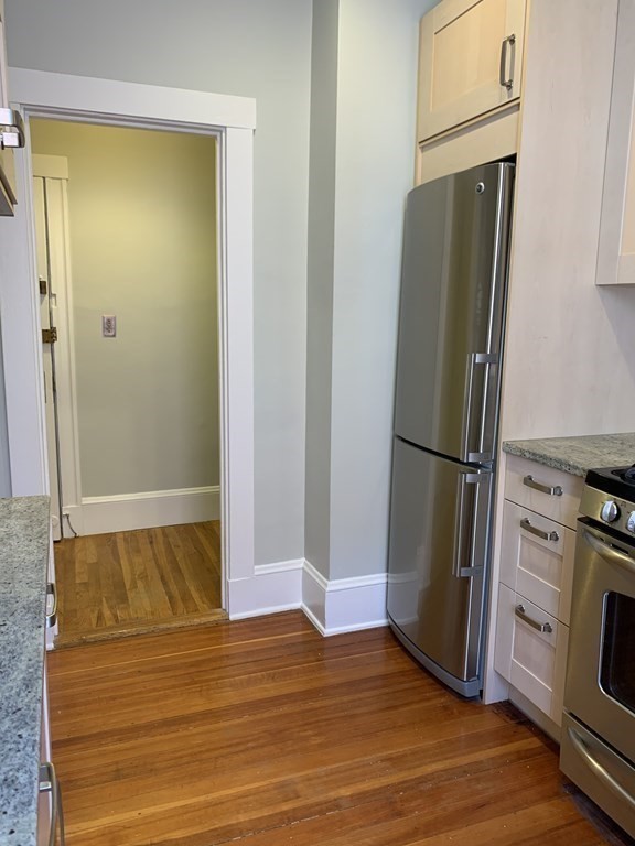 38 Kilsyth Road, Unit 33 Brookline, MA 02445 - Photo 13 of 23 a view of kitchen with wooden floor and electronic appliances