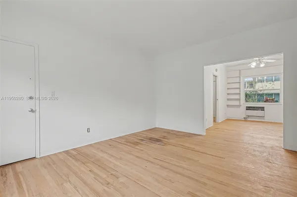 a view of an empty room with a window