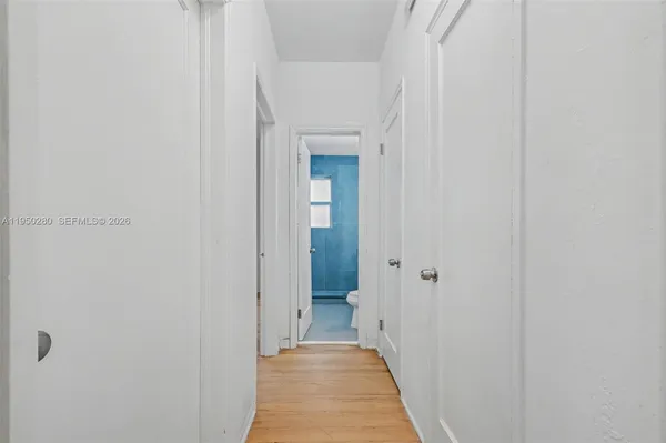 a view of a bathroom from a hallway