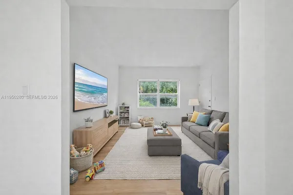 a living room with furniture and a flat screen tv
