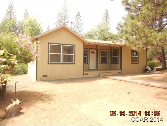 85 Ridge Road Mokelumne Hill, CA 95245 - Photo 1 of 1 a front view of a house with a yard and garage