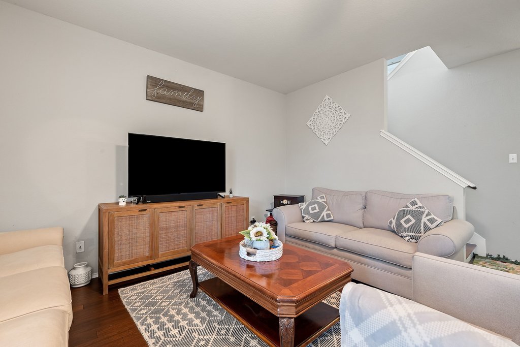 140 Wolfberry Path Buda, TX 78610 - Photo 3 of 35 a living room with furniture and a flat screen tv