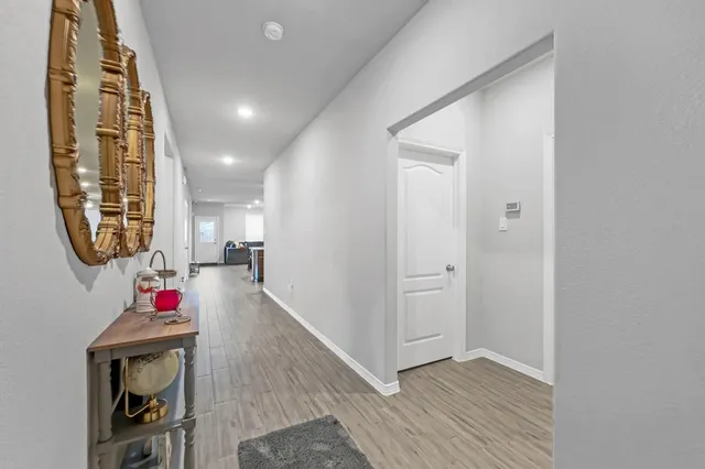 an entryway and livingroom with furniture