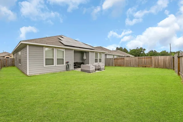 a front view of a house with yard