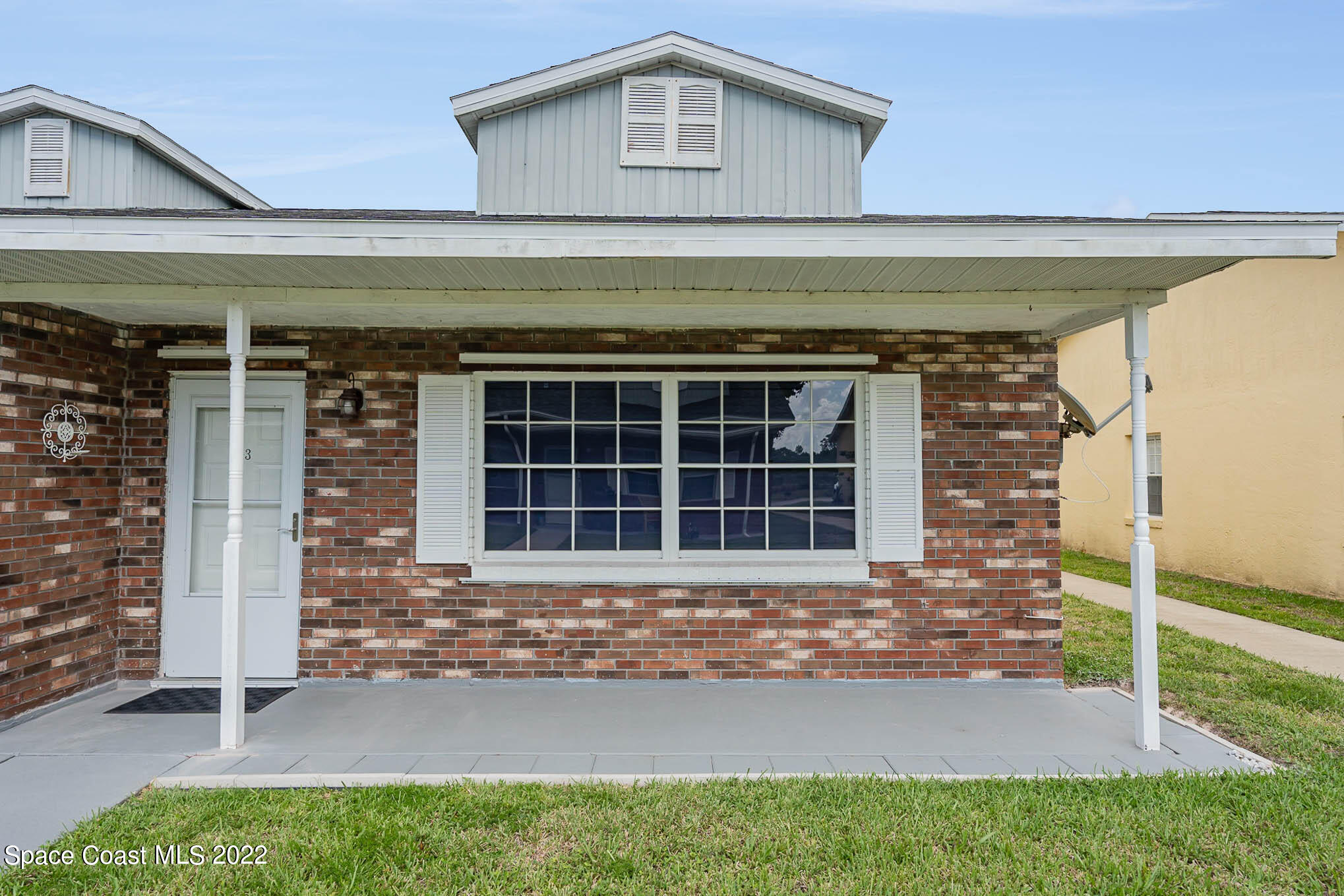 8520 Highway 1, Unit G3 Micco, FL 32976 - Photo 1 of 24 a front view of a house with a yard