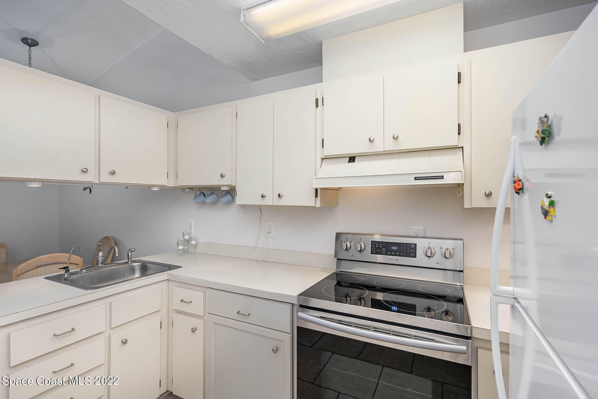 8520 Highway 1, Unit G3 Micco, FL 32976 - Photo 11 of 24 a kitchen with cabinets appliances and a sink