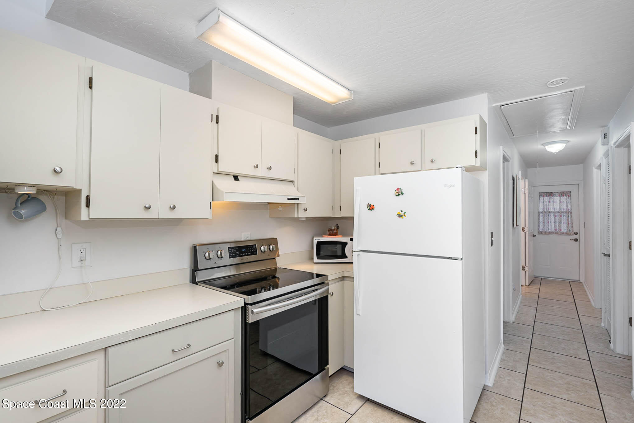 8520 Highway 1, Unit G3 Micco, FL 32976 - Photo 12 of 24 a white refrigerator freezer sitting in a kitchen
