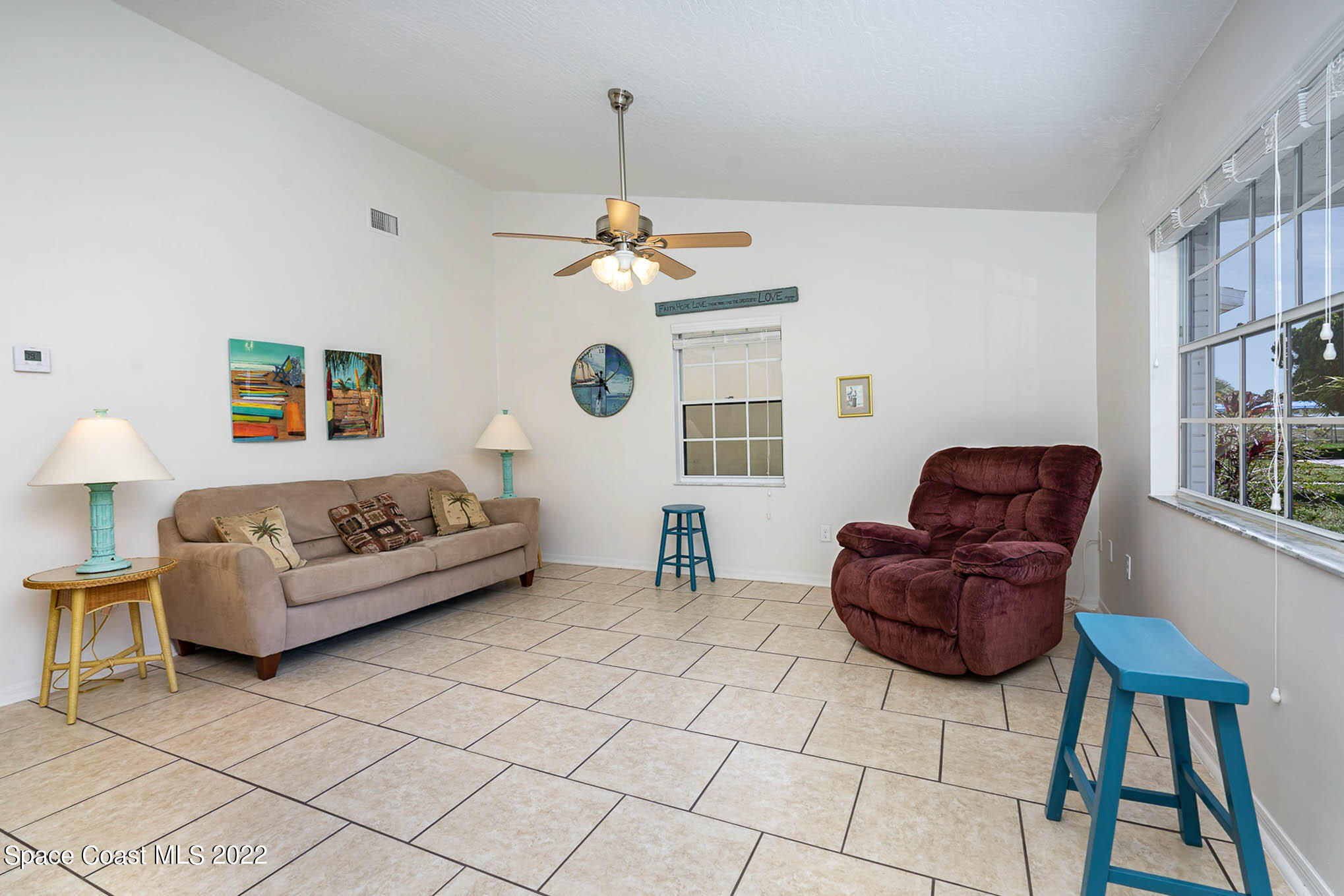 8520 Highway 1, Unit G3 Micco, FL 32976 - Photo 16 of 24 a living room with furniture and a chandelier