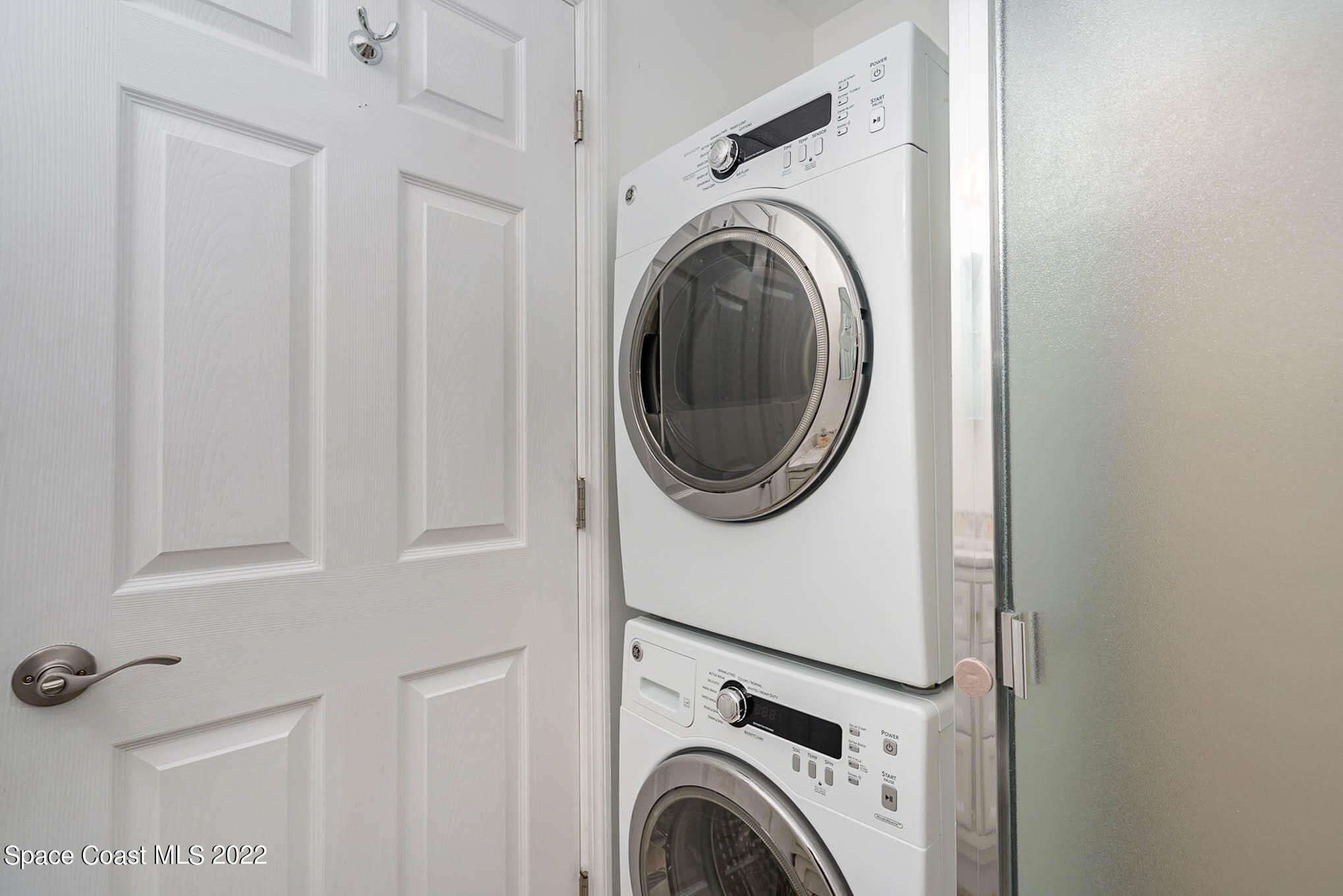 8520 Highway 1, Unit G3 Micco, FL 32976 - Photo 18 of 24 a view of a hallway with washer and dryer