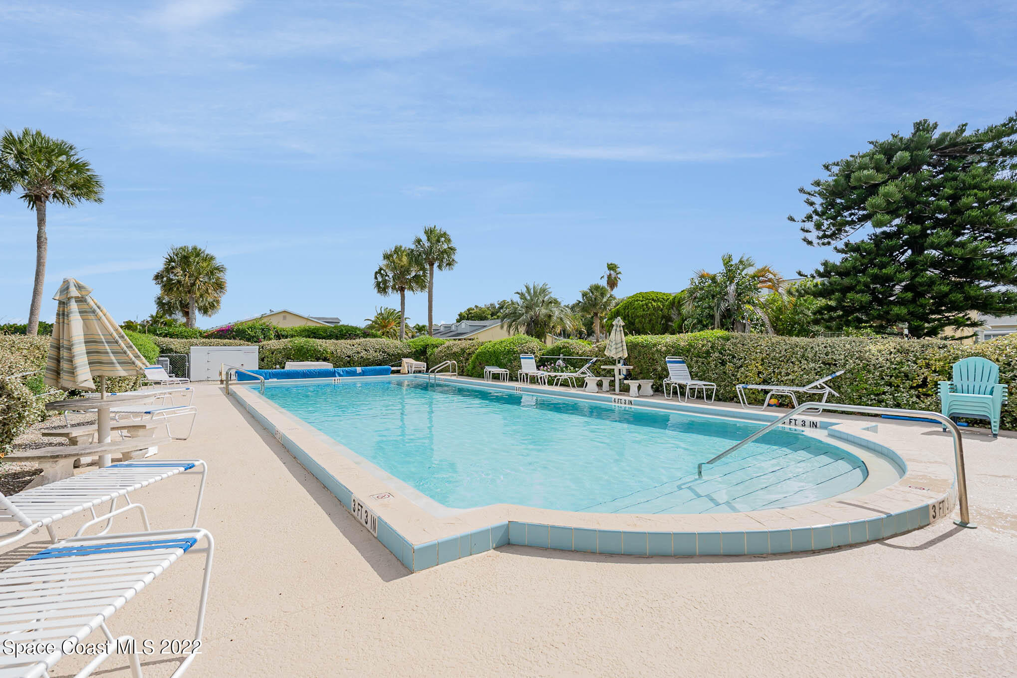 8520 Highway 1, Unit G3 Micco, FL 32976 - Photo 23 of 24 a view of a swimming pool with a yard and seating