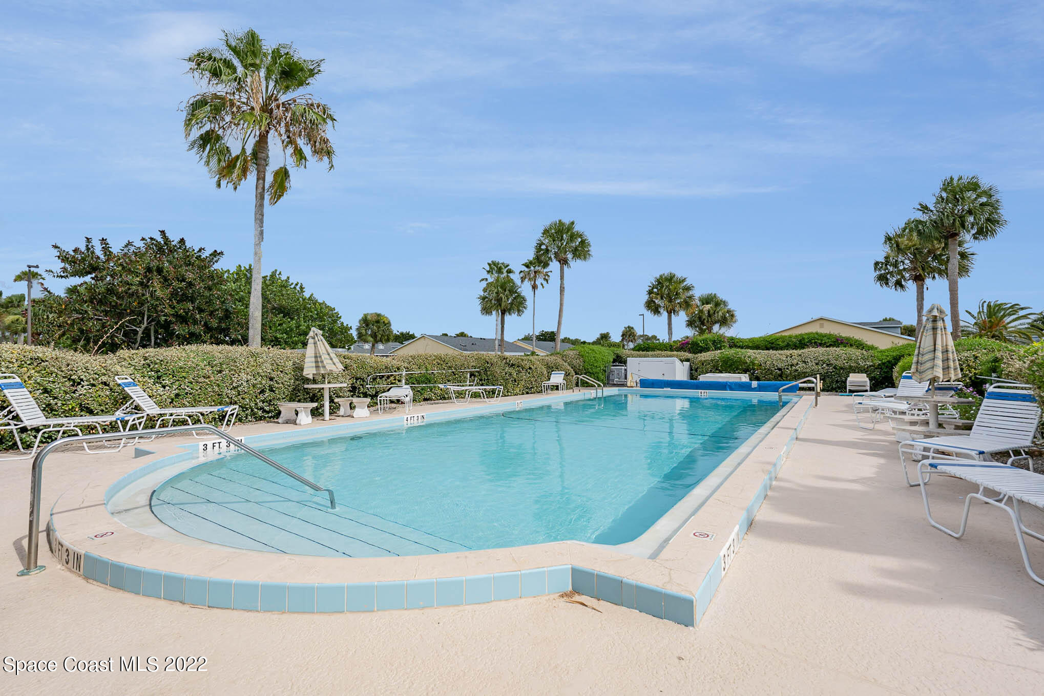 8520 Highway 1, Unit G3 Micco, FL 32976 - Photo 24 of 24 a view of a swimming pool with a yard and plants