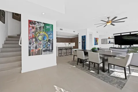 a view of a livingroom with furniture and a flat screen tv