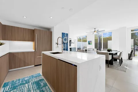 a kitchen with counter top space sink and center island