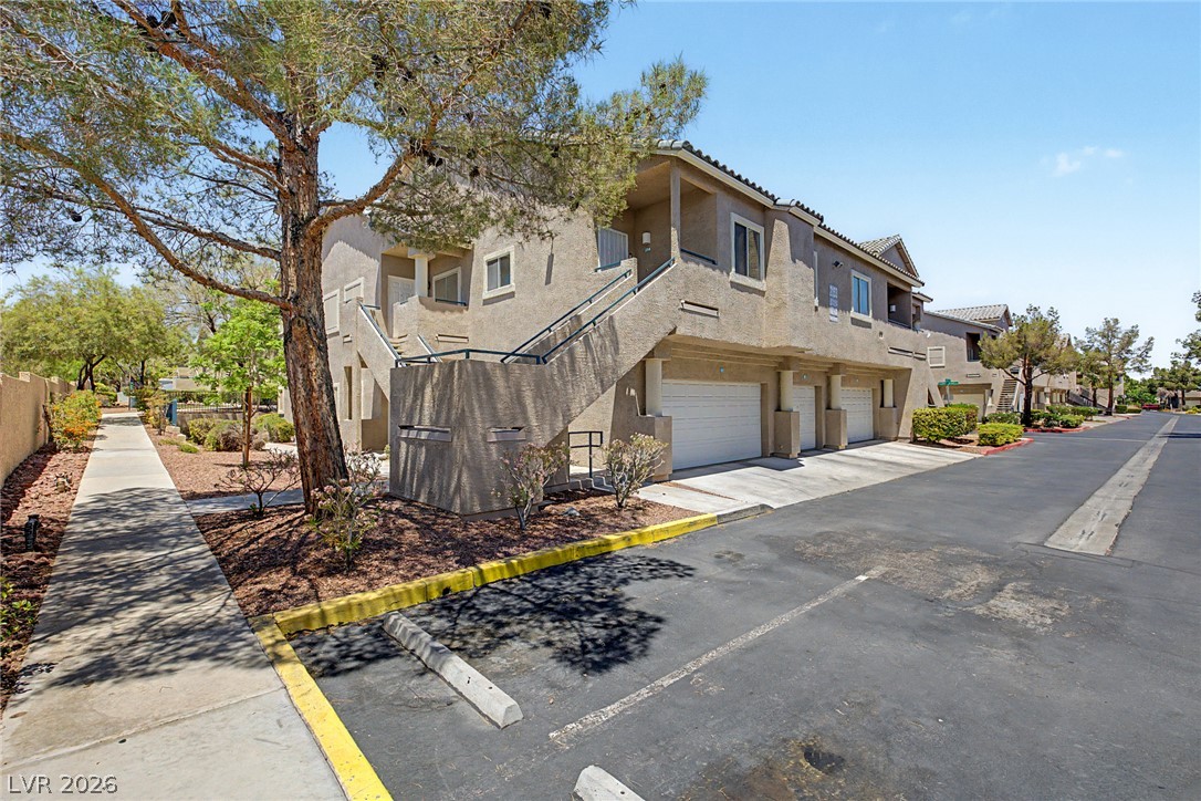 2153 Quarry Ridge Street, Unit 103 Las Vegas, NV 89117 - Photo 7 of 42 Multi-level residential units offer individual garages and convenient exterior stair access.