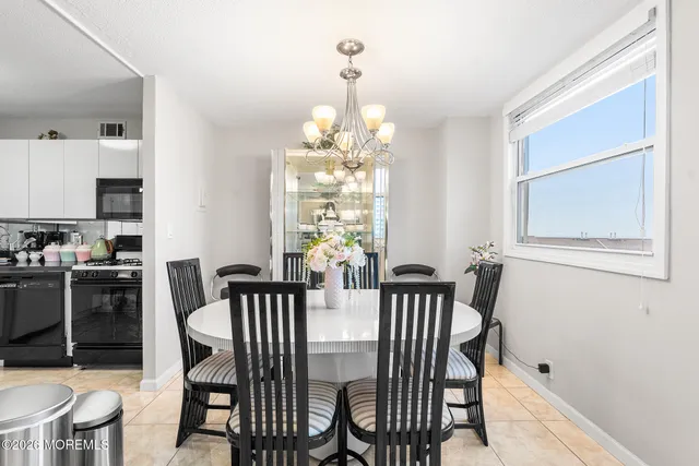 a kitchen with a stove a refrigerator and a sink