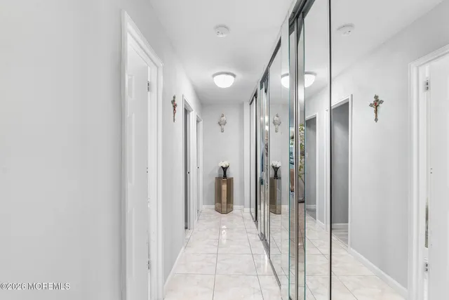 a bedroom with two beds and a dresser