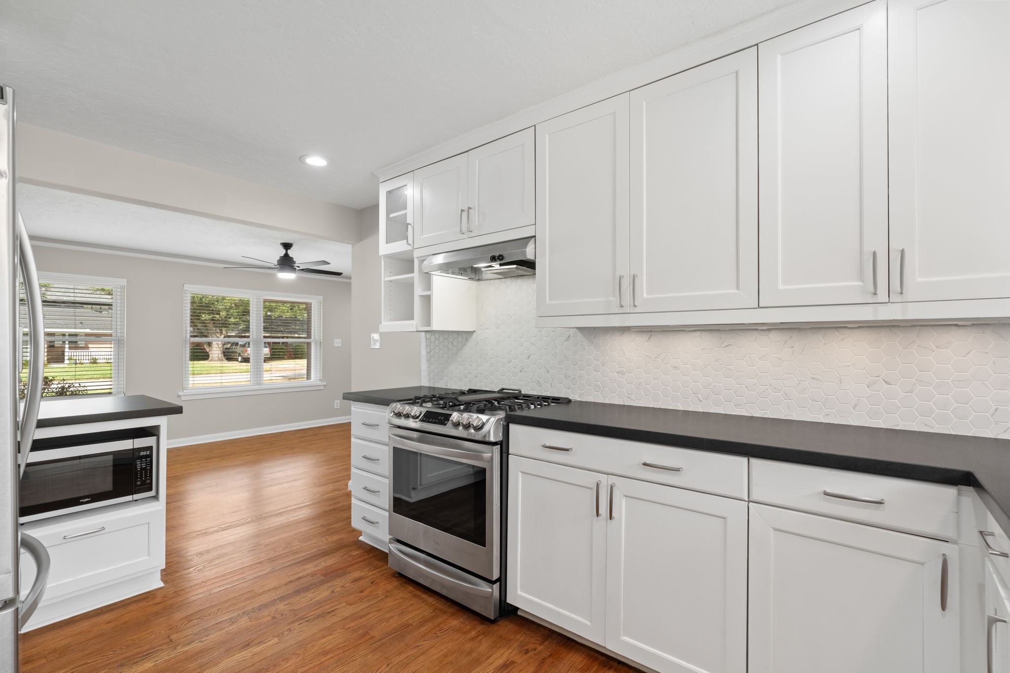 2007 Wakefield Drive Houston, TX 77018 - Photo 11 of 29 Fully updated kitchen featuring modern finishes with warm, inviting touches. Thoughtfully designed for cooking and open to the dining area, making meal prep and entertaining both easy and enjoyable.