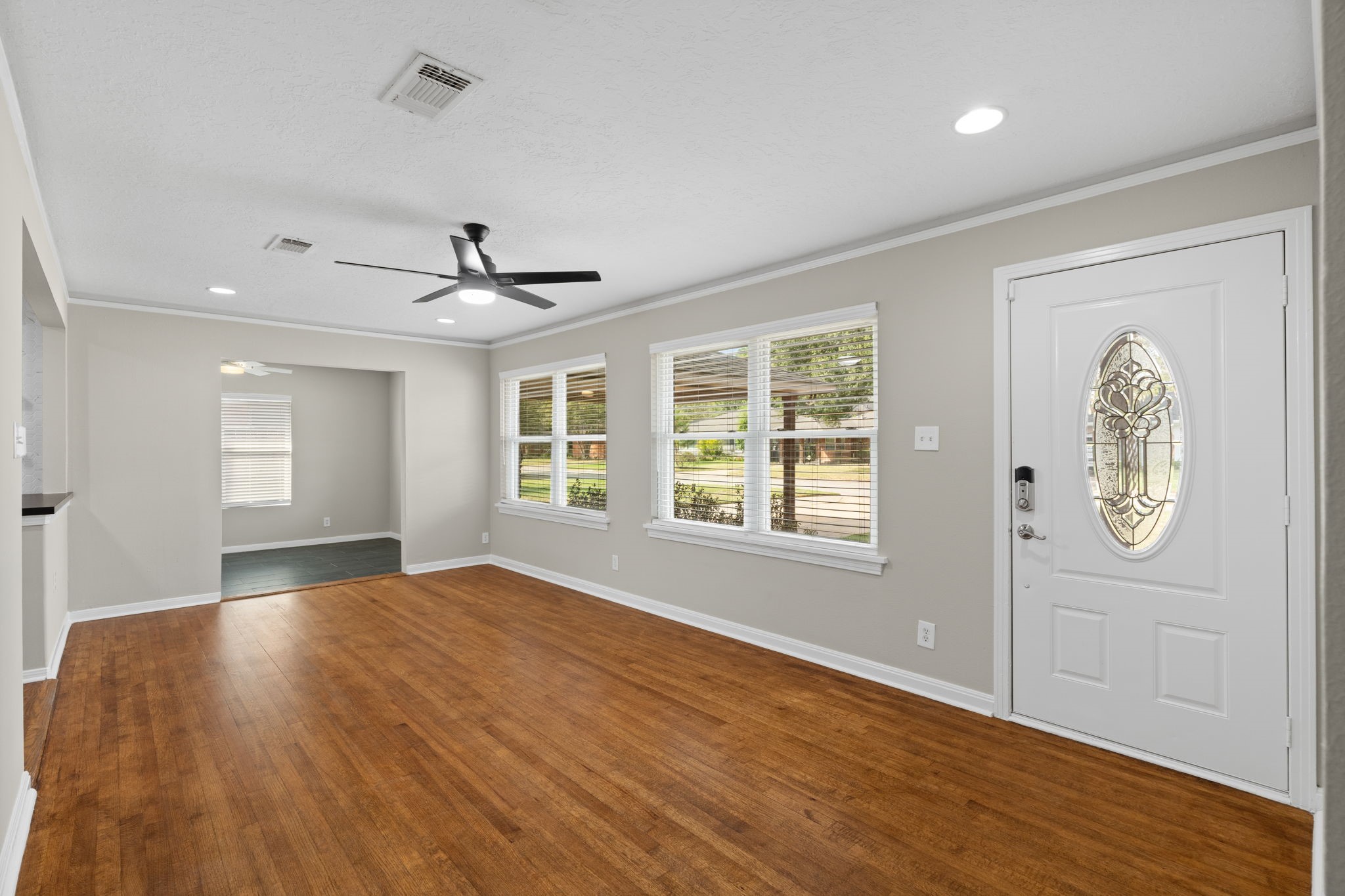 2007 Wakefield Drive Houston, TX 77018 - Photo 4 of 29 Step inside to a light-filled living room with beautiful hardwood floors and a fresh, modern feel. The open layout and large windows make this the perfect place to relax or entertain.