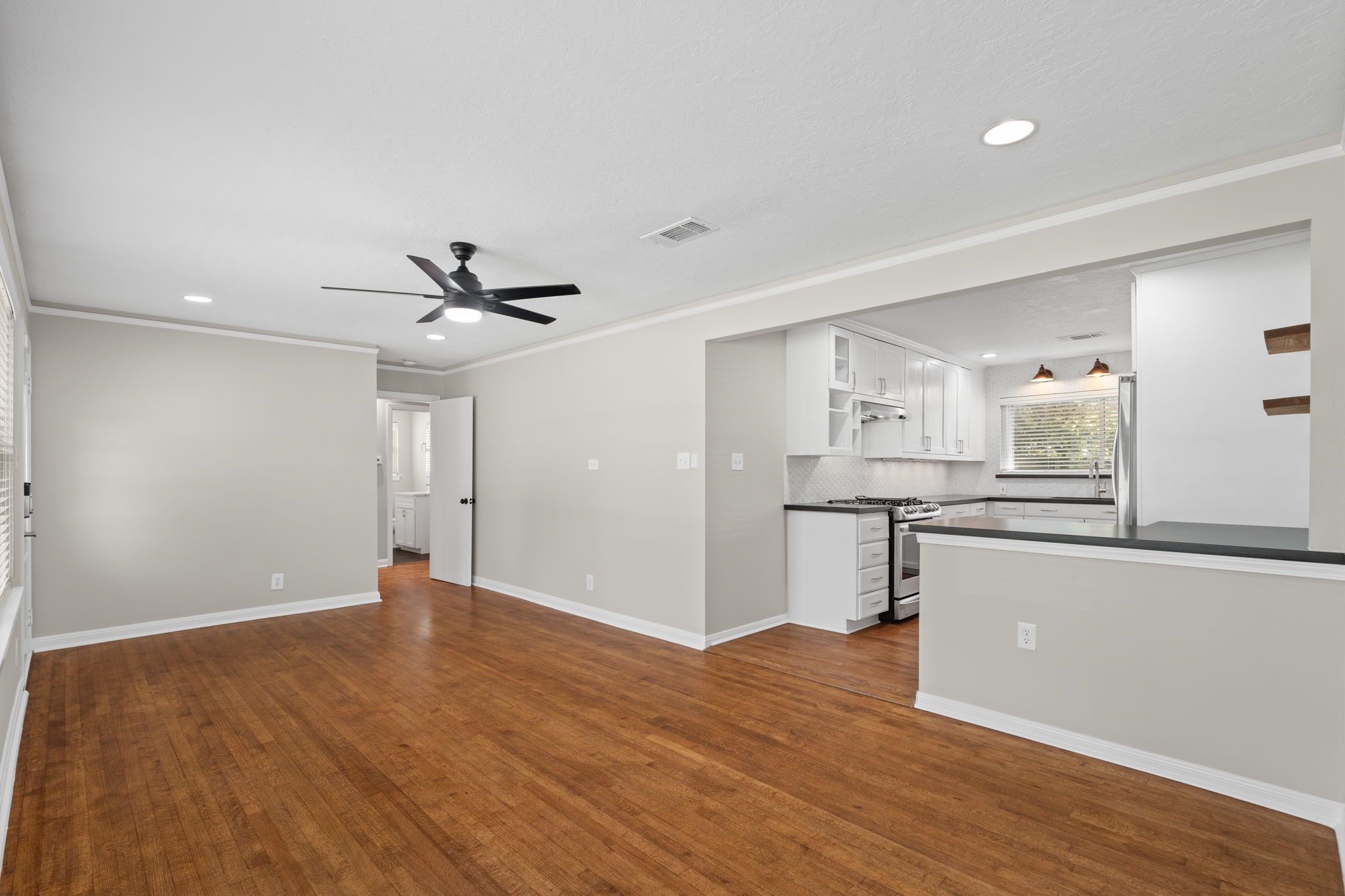 2007 Wakefield Drive Houston, TX 77018 - Photo 7 of 29 This open living and dining layout invites you to relax and entertain with ease. Natural light, gleaming hardwood floors, and a fresh modern design make every moment at home enjoyable.