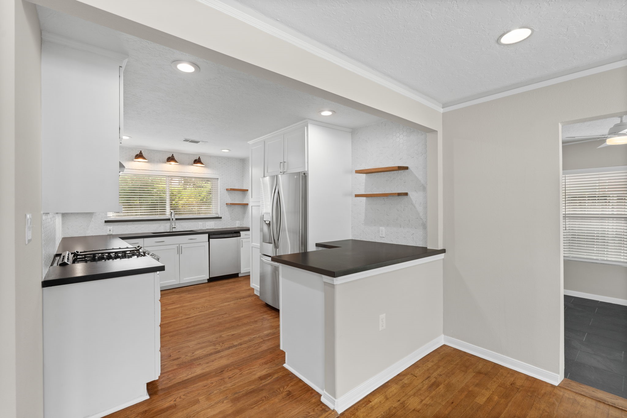 2007 Wakefield Drive Houston, TX 77018 - Photo 9 of 29 Fully updated kitchen featuring modern finishes with warm, inviting touches. Thoughtfully designed for cooking and open to the dining area, making meal prep and entertaining both easy and enjoyable.