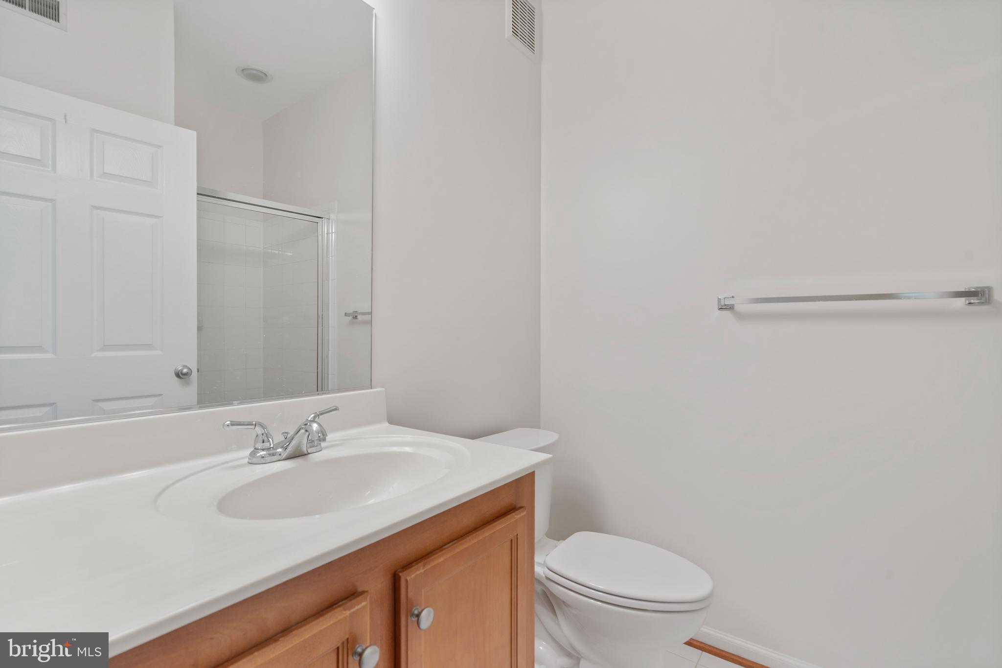 1509 North Point Drive, Unit 103 Reston, VA 20194 - Photo 25 of 33 Hall bathroom