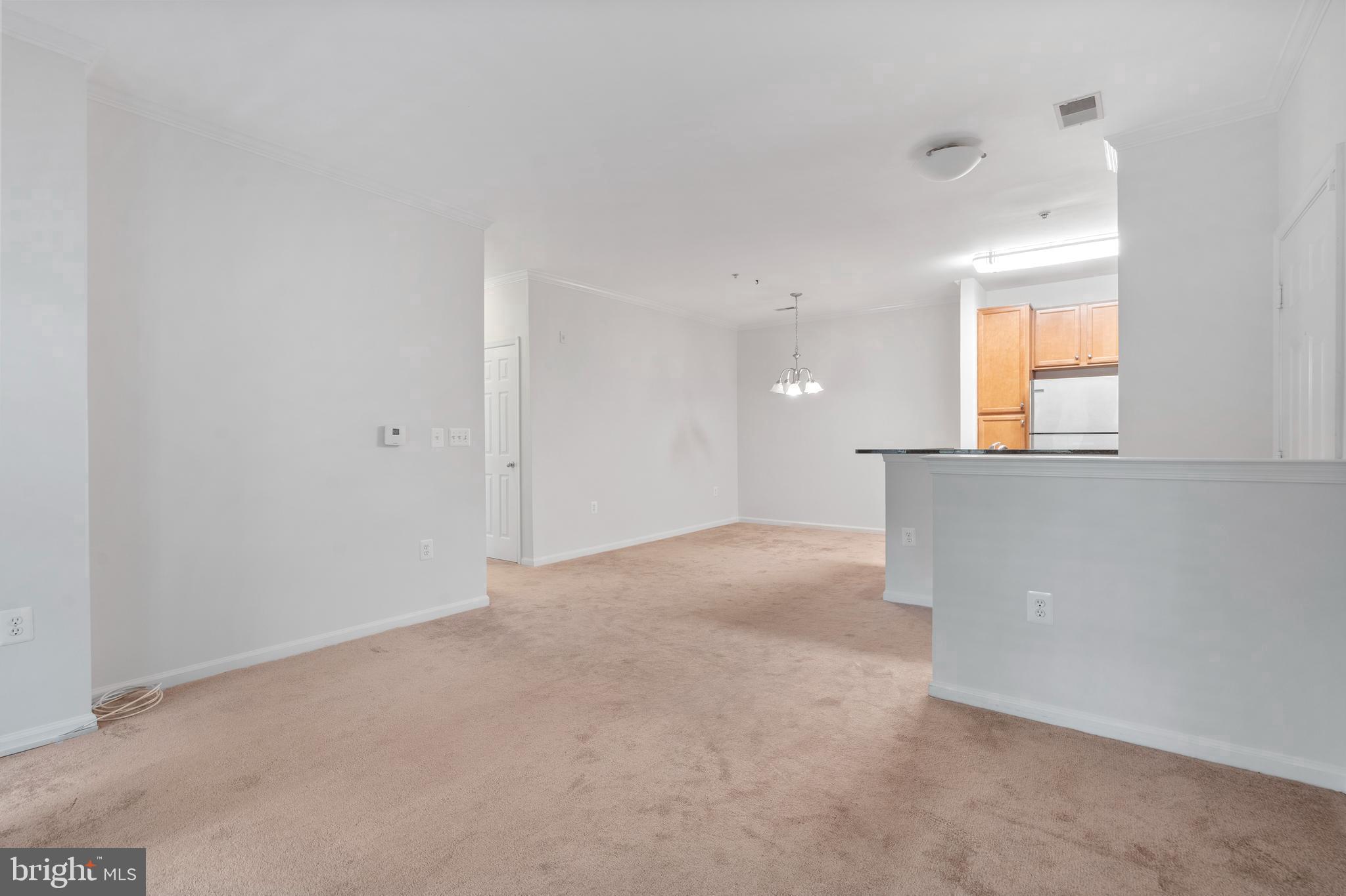 1509 North Point Drive, Unit 103 Reston, VA 20194 - Photo 5 of 33 Living Room/Dining Room