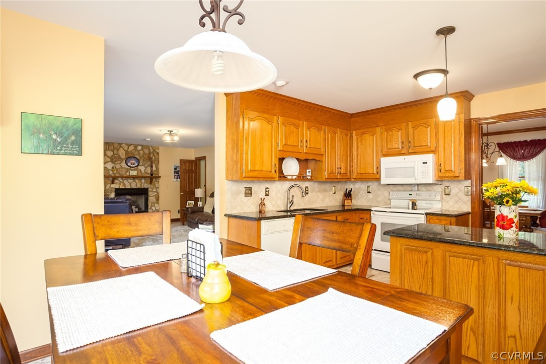9212 Cattail Road Chesterfield, VA 23838 - Photo 17 of 47 a kitchen with stainless steel appliances kitchen island granite countertop a sink and cabinets