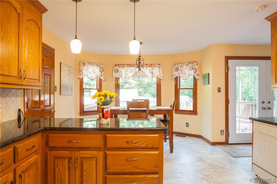 9212 Cattail Road Chesterfield, VA 23838 - Photo 18 of 47 a kitchen with a refrigerator a sink dishwasher and a large mirror next to a window