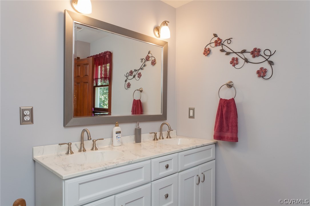 9212 Cattail Road Chesterfield, VA 23838 - Photo 25 of 47 a bathroom with a sink vanity and a mirror