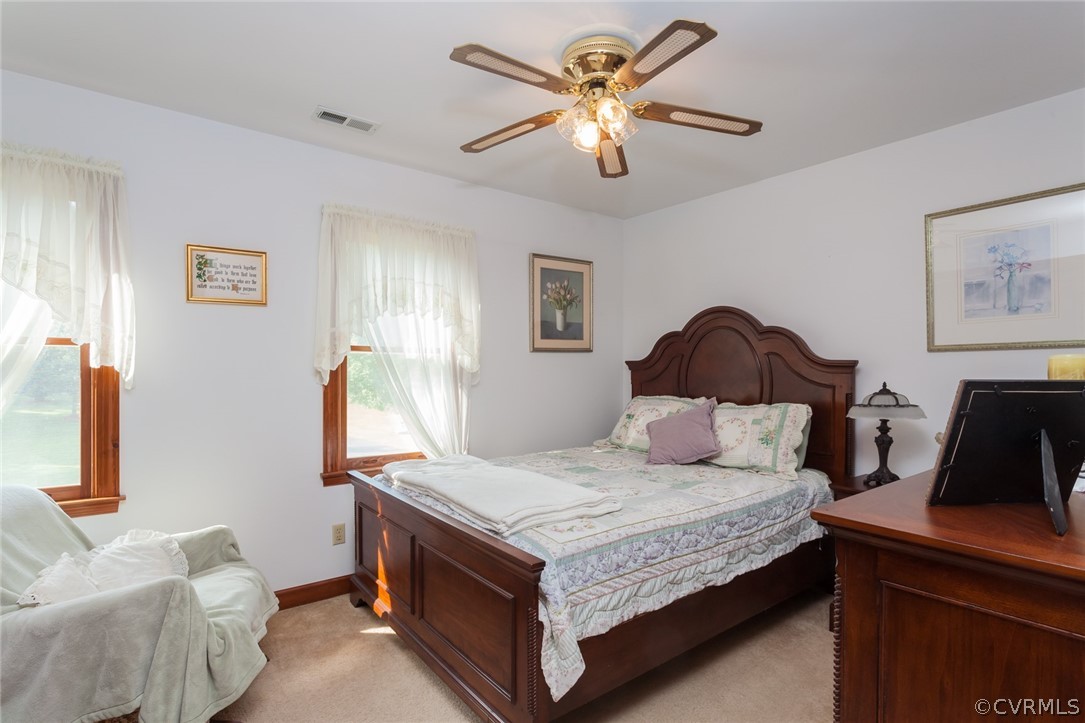 9212 Cattail Road Chesterfield, VA 23838 - Photo 28 of 47 a bedroom with a bed and a chandelier