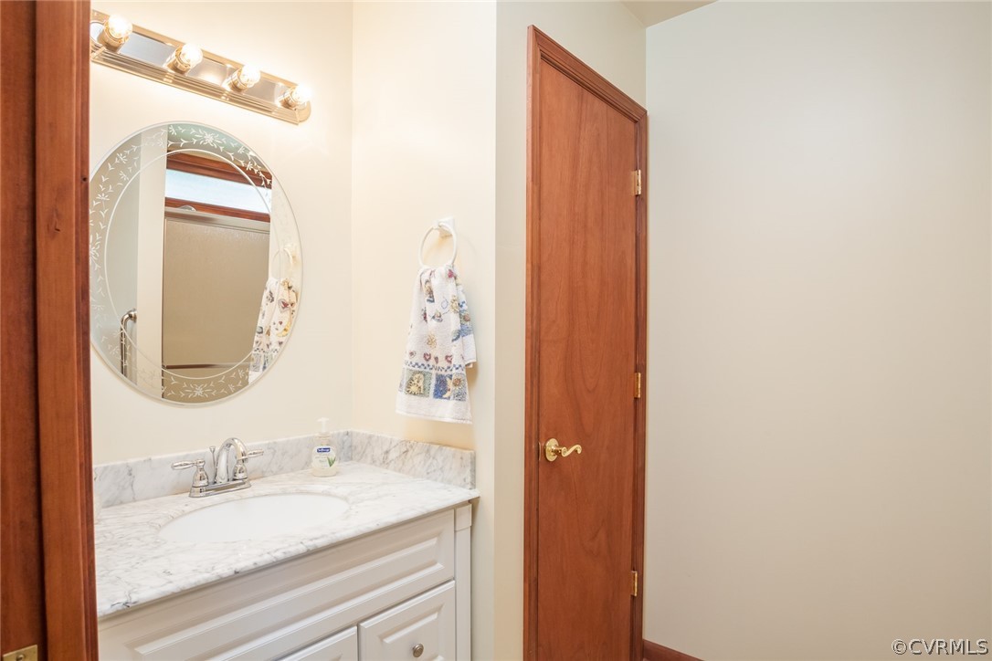 9212 Cattail Road Chesterfield, VA 23838 - Photo 40 of 47 a bathroom with a granite countertop sink and a mirror