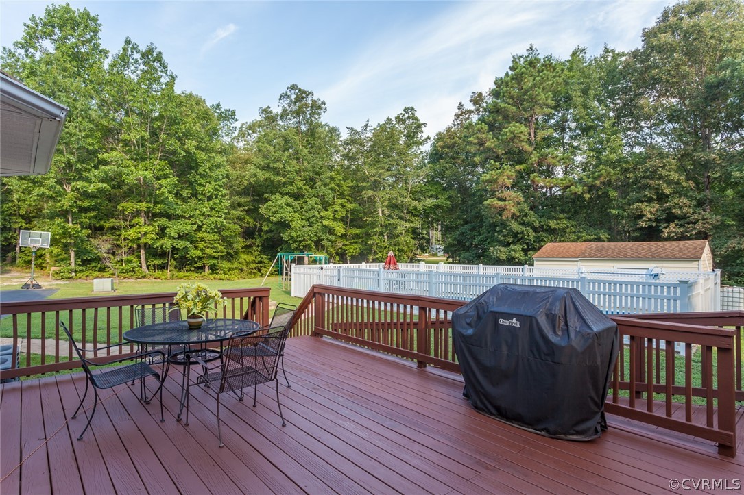 9212 Cattail Road Chesterfield, VA 23838 - Photo 44 of 47 a view of a deck with furniture and trees around