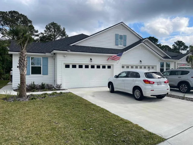 a view of a car park in front of house