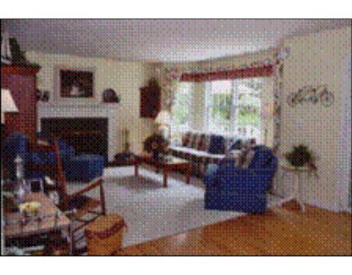 356 Lowell Road Groton, MA 01450 - Photo 4 of 5 a living room with furniture and a fireplace