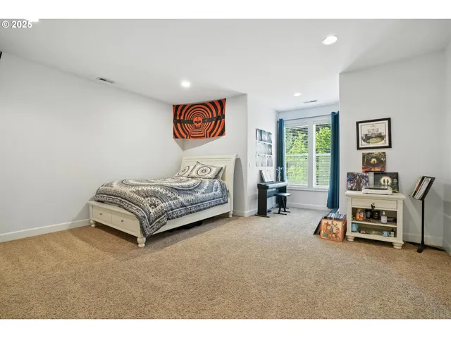 a living room with furniture and large windows