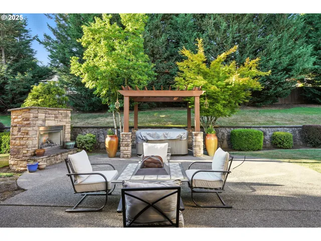 a view of backyard of house with seating space