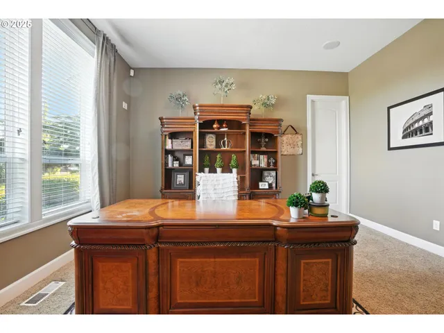 a view of a livingroom with furniture and hardwood floor