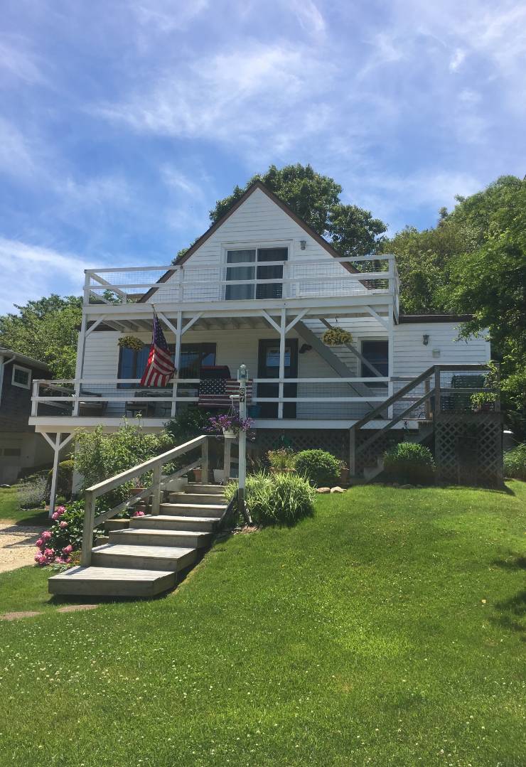 a front view of a house with a yard