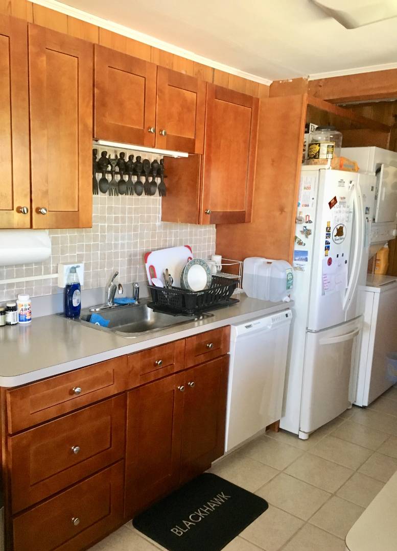 67 2nd House Road Montauk, NY 11954 - Photo 6 of 7 a kitchen with a refrigerator and cabinets