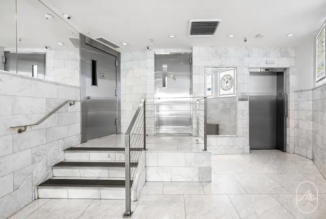 a view of entryway and kitchen