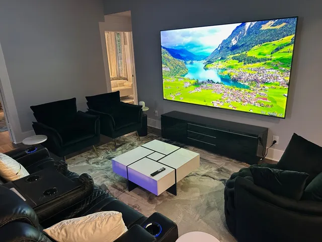 a living room with furniture and a flat screen tv