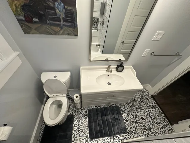 a bedroom with a bed and a fireplace