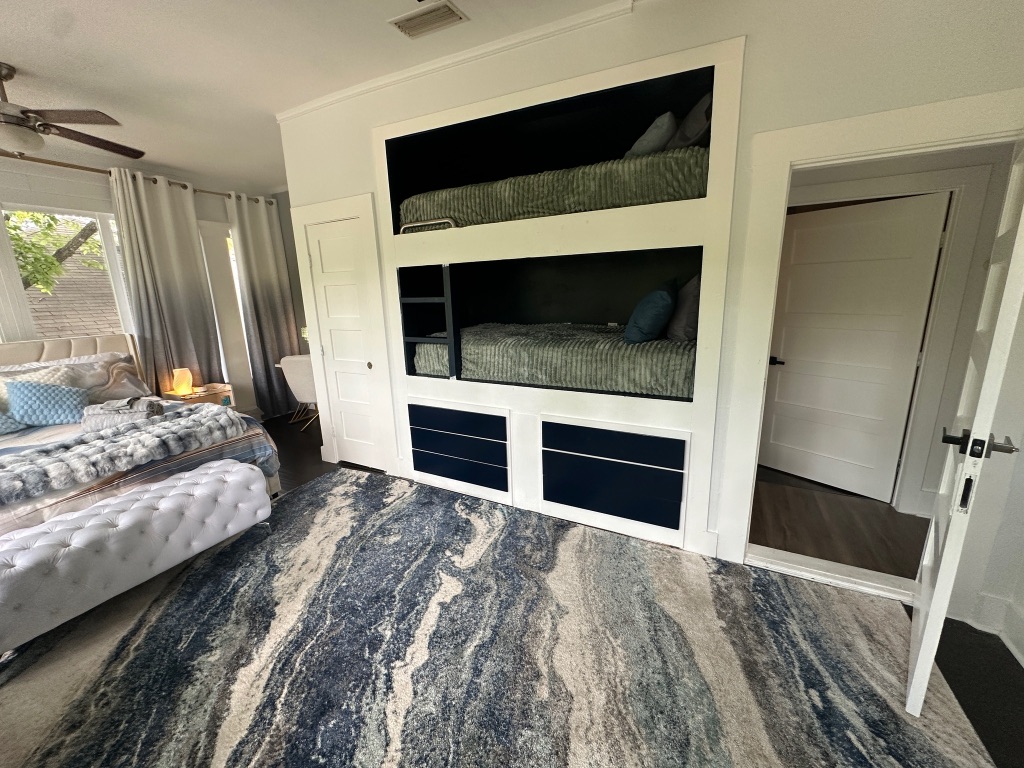 3210 Hampton Road, Unit A B C Austin, TX 78705 - Photo 18 of 39 a bedroom with a bed and a fireplace