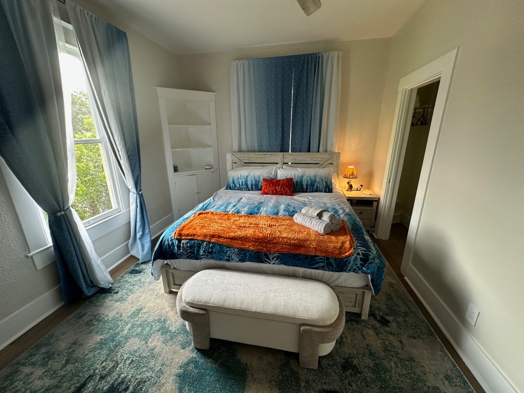 3210 Hampton Road, Unit A B C Austin, TX 78705 - Photo 21 of 39 Bedroom featuring wood finished floors and ceiling fan